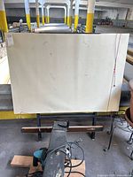 Front view showing full drafting surface and metal stand