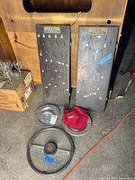 All items grouped: MG steering wheel, two Bon-E-Con peg boards, two visible Bonney Forge hub caps, ashtray covered by Yamaha cloth