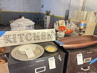 Group shot showing all six items: wood sign, glass bowl, mortar & pestle, wood candlestick/vase, wood dough bowl, decorative plate