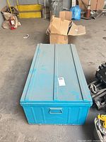 Closed blue steel jobsite chest top view