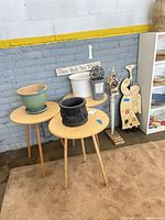 Overview showing planters, lantern, pedestal, sign and decorative pieces