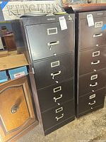 Full view of Shaw-Walker dark brown four-drawer vertical filing cabinet