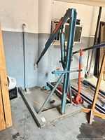 Full view of steel engine hoist on shop floor