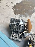 Top view of air-cooled flat-4 short block with cylinders and studs, corrosion visible