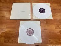 Gatefold jacket with two white vinyl discs and inner sleeves displayed