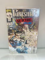 Front view of The Punisher War Journal #61 comic in bag with signatures visible