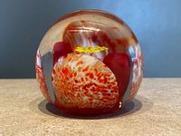 Front view showing overall spherical form and colorful interior design