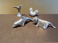 Group shot of the four polished aluminum Hoselton animal sculptures
