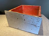 Overall view: exterior blue-gray side and red interior