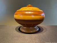 Full view of the turned wooden bowl with lid and pedestal