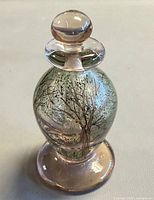 Front view of hand blown art glass perfume bottle with stopper