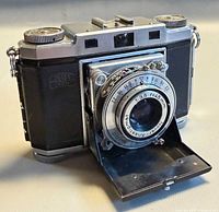 Front angled view of Zeiss Ikon Contina II with lens door open
