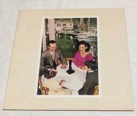 Front jacket with family table scene and The Object