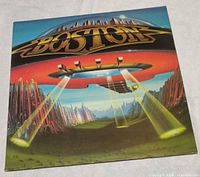 Front cover art with Boston logo and spaceship