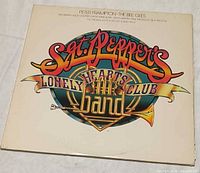 Front of gatefold jacket with title graphics