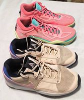 Side view of both sneaker pairs showing colors and design