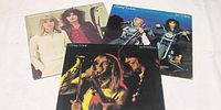 Front jackets of three Cheap Trick albums