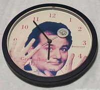 Front view of clock showing Bill Murray image, numerals and hands