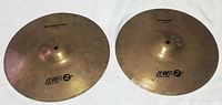 Top and bottom hi-hat cymbals, logos visible