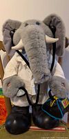 Full view of 22-inch animatronic plush elephant in doctor outfit with stethoscope and doctor bag