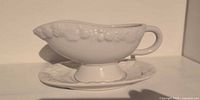 Side view of gravy boat on underplate