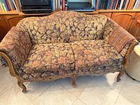 Front view of loveseat showing entire frame, cushions and overall condition