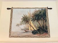 Frontal view of tapestry on wall with rod and finials visible