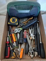 Overview of boombox and box of assorted tools