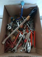 Overview of box with assorted hand tools