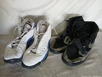 Both pairs of Nike shoes side by side