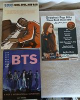 Front covers of all three music books in the lot