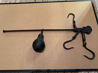 Full view of scale with beam, counterweight and hooks