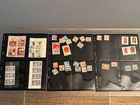 Overview of six binder sleeves filled with assorted stamps