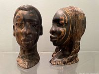 Front three-quarter view of both ebony busts