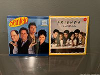 Front covers of Seinfeld and Friends 2021 calendars, shrink-wrapped