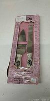 Front view of boxed Enesco porcelain wedding cake knife and server set