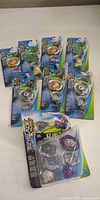 All nine sealed Beyblade Burst Slingshock packages spread on surface