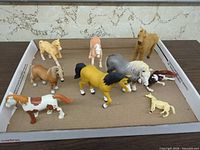 Tray of eleven assorted small horse figurines