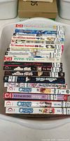 Stack of 18 manga volumes showing series titles and stickers