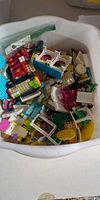Container filled with assorted LEGO Friends pieces
