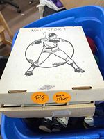 Closed long box labeled "NON SPORT" sitting in tote