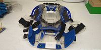 Front view of Thor clear and blue youth chest protector with shoulder guards and straps