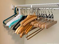 Front view of entire assortment on closet rod