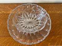 Platter under bowl showing starburst patterns and scalloped rims