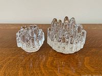 Front view of both Polaris candle holders