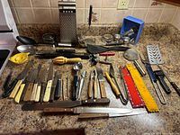 Full countertop view of entire utensil and cutlery lot