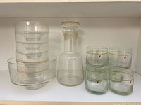 Group view showing decanter, stacked bowls and six of the tumblers