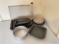 group shot of all pans, rack and rolling pin