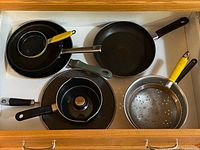Drawer view showing all cookware pieces together