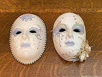 Both Berco porcelain masks side by side showing overall designs and size relationship